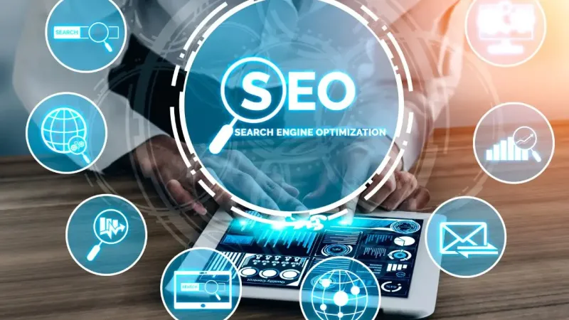 A hand touching a tablet, with a circle reading SEO and search, email and chart icons around it