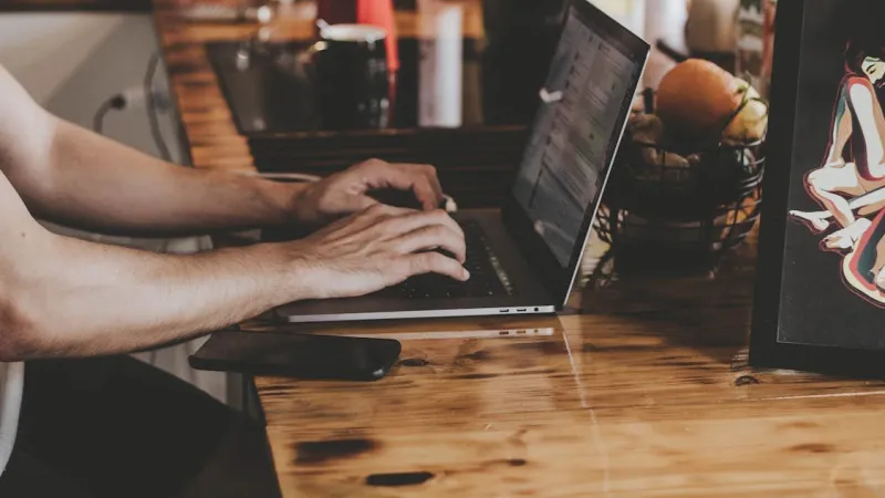 Professional coding setup with dark screens for configuring WordPress plugins
