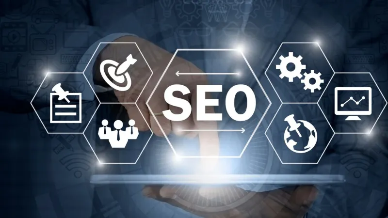 Hand touching a hexagon icon labelled SEO, surrounded by target, team, gear and chart icons above a tablet