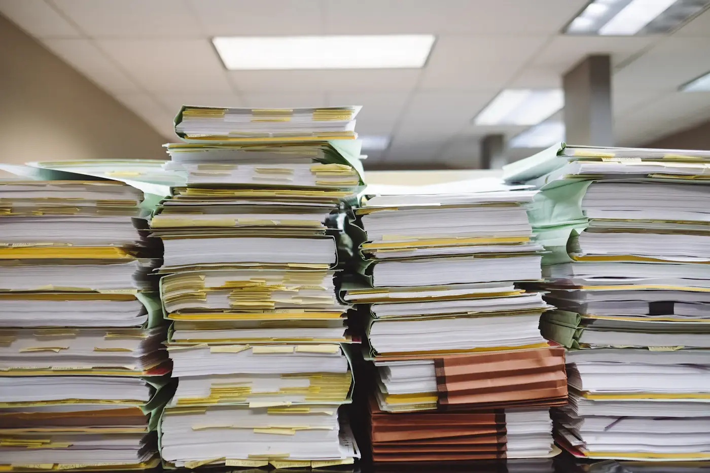 Stacks of papers and folders in an office