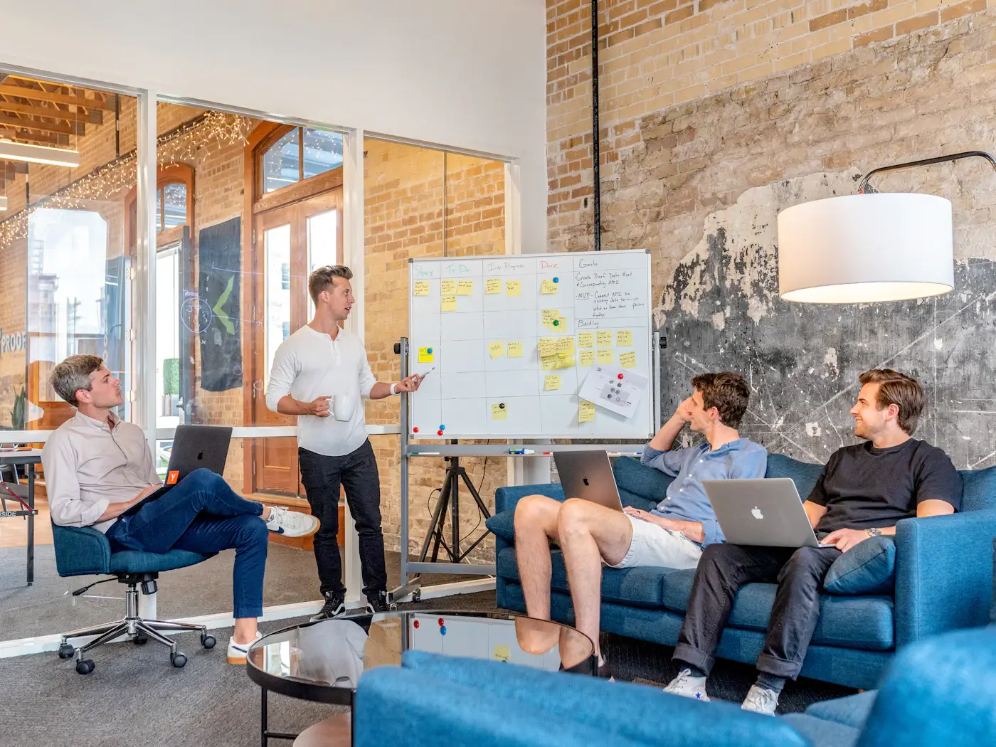 A team planning strategy at a whiteboard