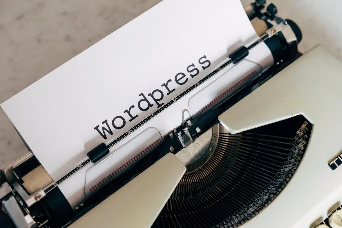 A developer using a MacBook to build a website