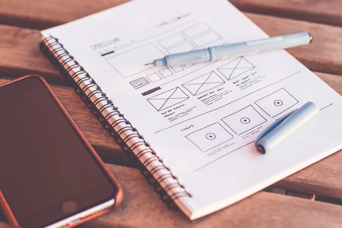 Best premium WordPress themes: a web designer choosing and customising a premium WordPress theme on a laptop